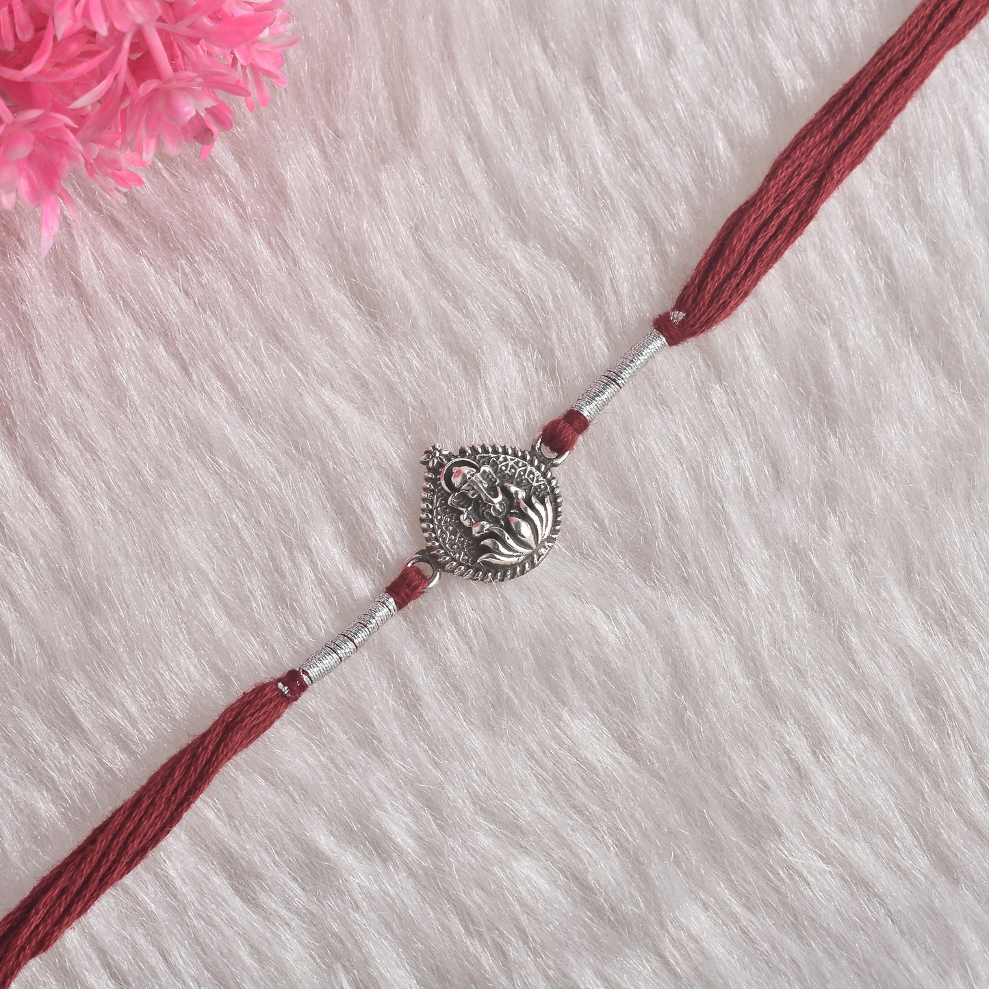 Silver Kamal Phool And Ganesha Rakhi