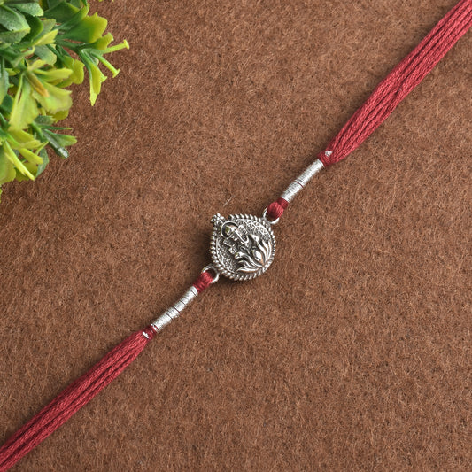 Silver Kamal Phool And Ganesha Rakhi